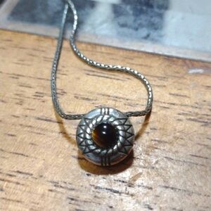 Brighton Fortino Reversible Necklace with a different stone on either side.